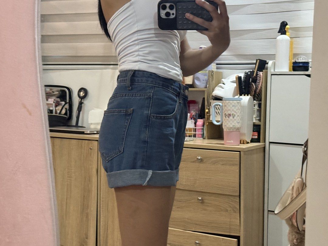 High waisted cuffed denim shorts medium wash (Category: Shorts) located in Manila. Submitted by mightystone-d948cd (Listing ID 1466772074, Image 3). Description: - Style: High waist denim shorts with cuffed hem - Wash: Medium wash - Closure: Front button and zipper with standard belt loops - Pockets: Functional front and back pockets - Material: Comfortable cotton denim - Fit: Easy to pair with basic tops or tanks for a casual everyday look.