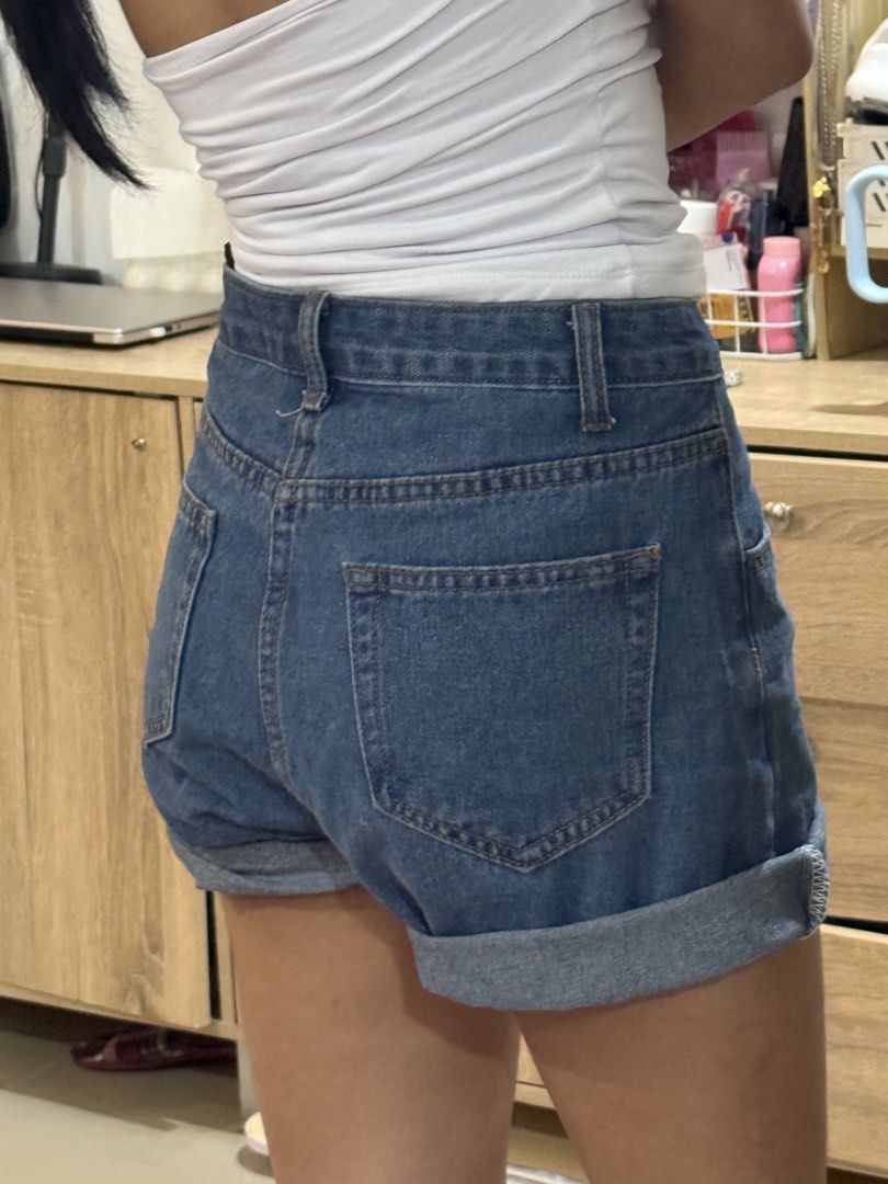 High waisted cuffed denim shorts medium wash (Category: Shorts) located in Manila. Submitted by mightystone-d948cd (Listing ID 1466772074, Image 2). Description: - Style: High waist denim shorts with cuffed hem - Wash: Medium wash - Closure: Front button and zipper with standard belt loops - Pockets: Functional front and back pockets - Material: Comfortable cotton denim - Fit: Easy to pair with basic tops or tanks for a casual everyday look.