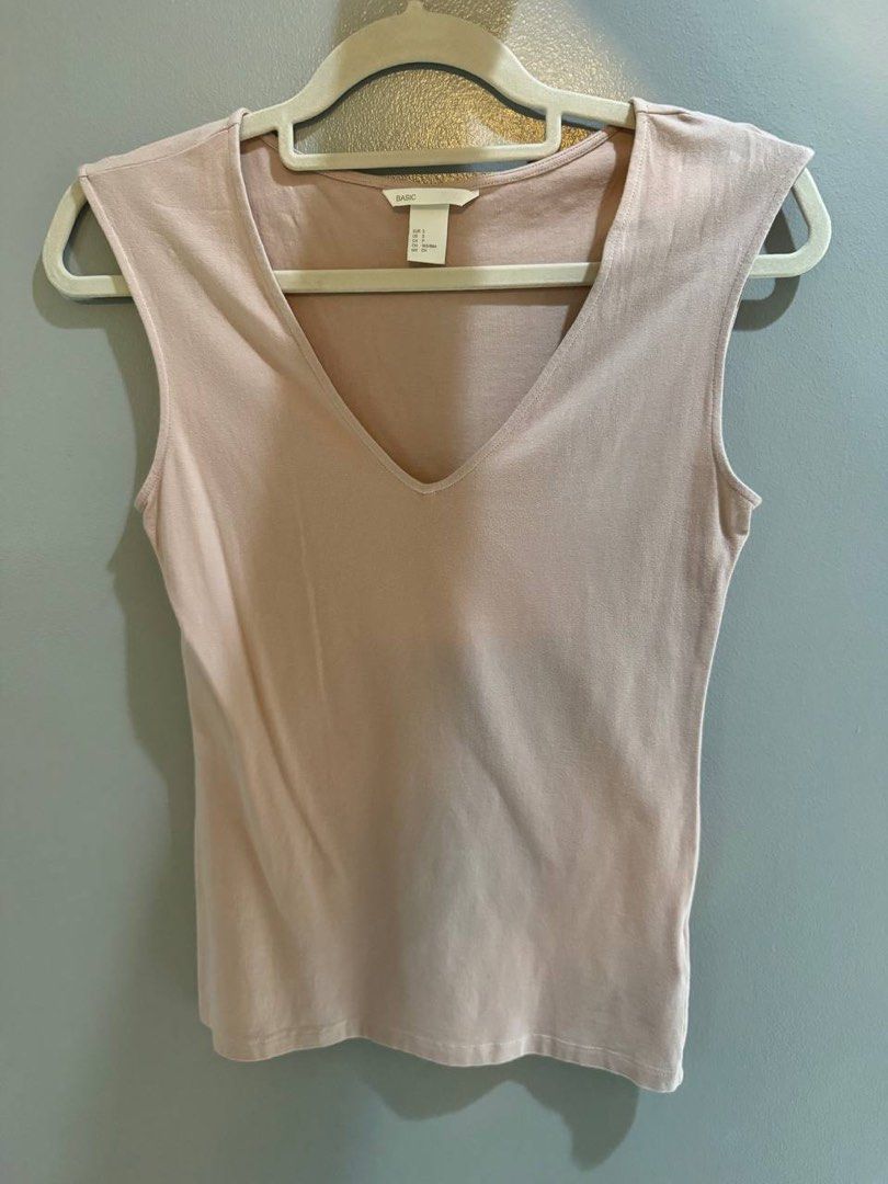 H&M Basic V-neck Cap Sleeve Top Pink Size S (Category: Sleeveless) located in Taguig. Submitted by anxmz (Listing ID 1466676176, Image 1). Description: - Brand/Model: H&M Basic - Color: Pink - Size: Small (EUR S, US S) - Style: V-neck, cap sleeves, fitted cut - Material: Soft cotton blend - Condition: Great everyday basic, perfect for layering or wearing on its own.