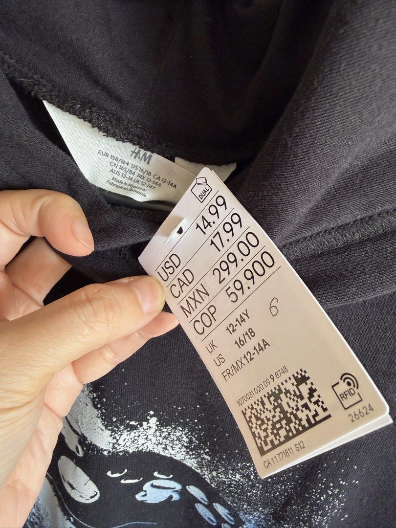 H&M Black Gaming Controller Graphic Hoodie (Category: Hoodies) located in Quezon City. Submitted by bubspreloved (Listing ID 1466719535, Image 3). Description: - Condition: Brand new with tags (BNWT), never worn - Design: Black hoodie with blue and white video game controller graphic - Fit & Comfort: Regular fit, soft fabric, pullover style with hood - Size: US 16/18 or UK 12-14Y.