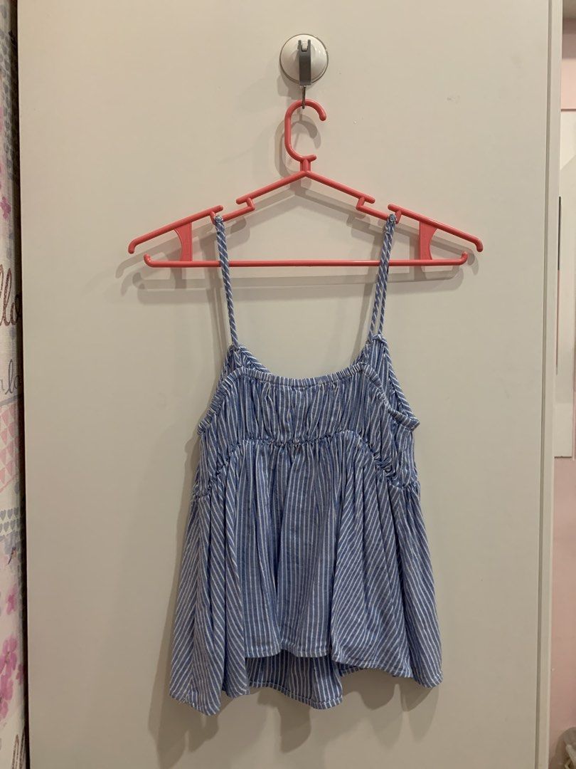 H&M Blue Striped Camisole Top (Category: Sleeveless) located in San Juan City. Submitted by itsmeannc89 (Listing ID 1466624134, Image 3). Description: - Brand: H&M - Size: S (EUR S, 160/88A) - Design: Blue and white stripes with gathered neckline - Fit: Relaxed and flowy with thin straps - Material: Light, breathable fabric ideal for warm weather.