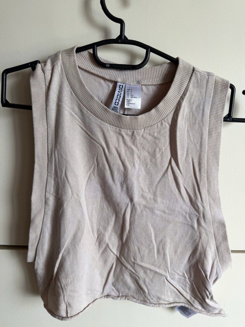 H&M Divided Beige Ribbed Tank Top Size S (Category: Sleeveless) located in Quezon City. Submitted by bubspreloved (Listing ID 1466702085, Image 1). Description: - Brand/Line: H&M Divided - Color: Beige - Size: S (tag) - Material: Comfortable cotton-blend, made in India - Details: Ribbed trim crew neckline, wide armholes - Style: Simple casual staple, easy to pair with high-waisted jeans or shorts - Condition: Great for warm weather Just washed bu