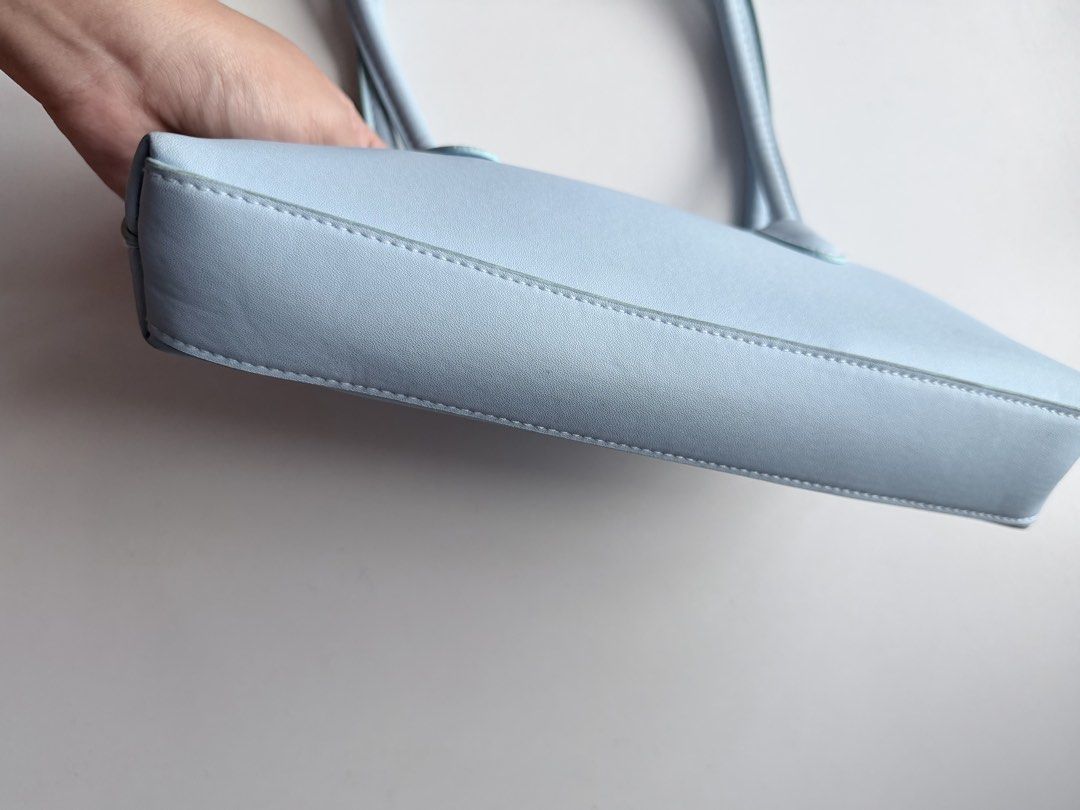 H&M Light Blue Shoulder Bag (Category: Shoulder Bags) located in Makati City. Submitted by withlovekhl (Listing ID 1466717657, Image 3). Description: Small shoulder bag with shoulder straps and a zip at the top. Taffeta lining. Depth 5 cm. Height 13 cm. Width 27 cm. just for decluttering, not for picky ⊹ ࣪ ˖ not open for swapping ty!.