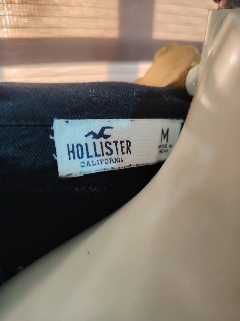 Hollister Black Utility Romper Size M (Category: Rompers) located in Manila. Submitted by ezekislacl02490 (Listing ID 1466636133, Image 3). Description: - Brand/Style: Hollister utility romper - Color: Solid black - Size: Medium - Features: Short sleeves, collar neckline, button-down front, chest pocket, side pockets, and a fitted waist - Origin: Made in India - Condition/Vibe: Casual, effortless one-piece outfit.