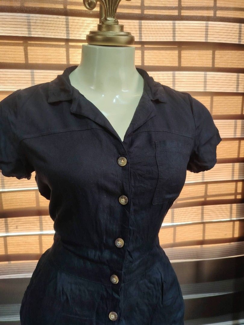 Hollister Black Utility Romper Size M (Category: Rompers) located in Manila. Submitted by ezekislacl02490 (Listing ID 1466636133, Image 2). Description: - Brand/Style: Hollister utility romper - Color: Solid black - Size: Medium - Features: Short sleeves, collar neckline, button-down front, chest pocket, side pockets, and a fitted waist - Origin: Made in India - Condition/Vibe: Casual, effortless one-piece outfit.