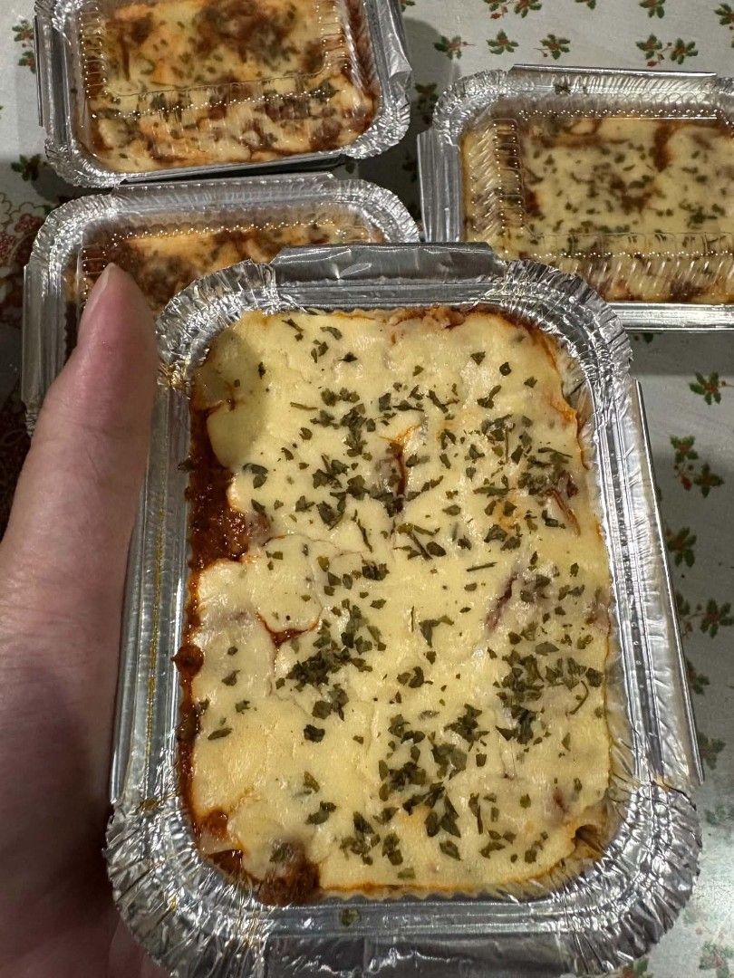 HOMEMADE CHEESY LASAGNA (Category: Homemade Bakes) located in Manila. Submitted by dianne0207 (Listing ID 1466675992, Image 3). Description: 🍝 HOMEMADE CHEESY LASAGNA 🧀❤️ Cheesy • Meaty • Creamy • Baked Fresh! Perfect for family meals, gatherings, or simply satisfying your lasagna cravings! 😋 ✨ AVAILABLE FOR PRE-ORDER ✨ 🥡 Small Tray (3 × 4 in) — ₱120 👨‍👩‍👧‍👦 Family Tray (7.5 × 7.5 in) — ₱720 🚚 DELIVERY THIS COMING SUNDAY 📌 Pre-order to 