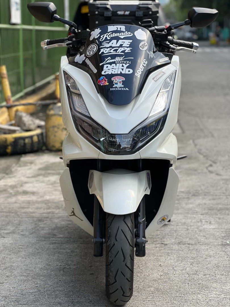 Honda PCX Scooter with Top Box (Category: Motorbikes for Sale) located in Manila. Submitted by ijhaytrixx (Listing ID 1466754680, Image 1). Description: For Sale Honda Pcx 160 V2 ABS - HSTC 2022 model 2022 acquired Original OR Original CR Original LTO Plate Complete Original Legal Documents Registered May 2027 Ready to transfer 1st owner acquired 2 Orig Remote Emergency key Code 44k odo Makapal Gulong Harap Likod With Top Box Tahimik Makina Smoot