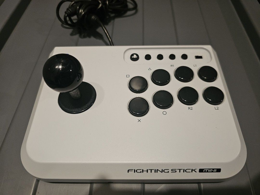 Hori Fighting Stick Mini for PS5, PS4, and PC (Category: Controllers) located in Paranaque City. Submitted by thenextnumber7 (Listing ID 1466687754, Image 2). Description: - Platform Compatibility: Works seamlessly with PlayStation 5, PlayStation 4, and PC - Compact Design: Space-saving layout ideal for gamers with limited desk space - Arcade Feel: Features a standard arcade joystick and responsive action buttons - Easy Switching: Convenient mode