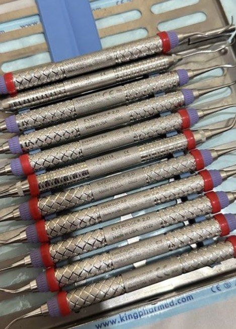HU FRIEDY PERIO INSTRUMENT SET (Category: Medical Supplies & Tools) located in Bacoor. Submitted by docnikhoe (Listing ID 1466570412, Image 1). Description: - Full set of authentic Hu-Friedy EverEdge 2.0 dental instruments - Includes durable stainless steel sterilization cassette tray - Features double-ended scalers and curettes - Ergonomic textured handles with purple and red color-coded rings - Clean condition and well-organized in the metal tr