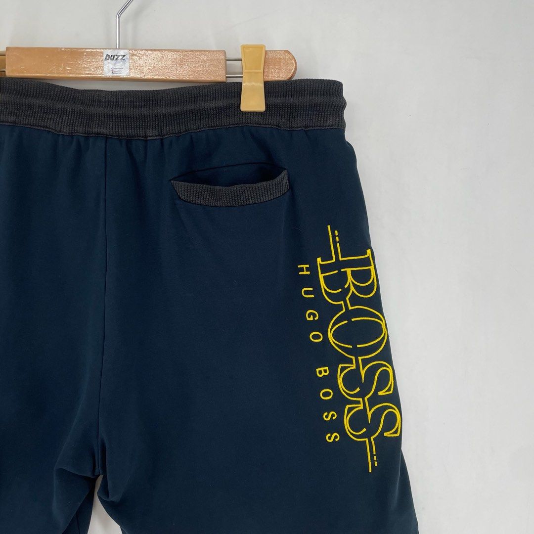 Hugo Boss Dark Blue Embroidered Drawstring Sweat Shorts Authentic (Category: Shorts) located in Manila. Submitted by buzz.garments (Listing ID 1466613302, Image 2). Description: Size: XXL on tag Dimensions(inches) -Waist/Width: 38”- 44” (Strechable) -Hip: 24.5” -Front Rise: 15” -Thigh: 13.5” -Inseam: 8.5” -Outseam/Length : 21.5” -Leg Opening: 11.5” - color may vary due to lighting. please manage your expectations-minimal and unseen flaws must be 