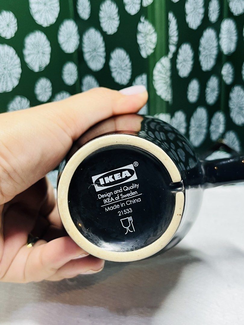 IKEA Black Ceramic Mug (Category: Coffee & Tea Tableware) located in Malabon City. Submitted by mgsurplus (Listing ID 1466576820, Image 2). Description: - Genuine IKEA black ceramic mug - Classic design featuring a sturdy, comfortable handle - Sleek glossy finish on the exterior - Authentic bottom stamp: IKEA, Design and Quality IKEA of Sweden, Made in China, 21533 - Certified food-safe - Perfect for daily coffee, tea, or hot chocolate.