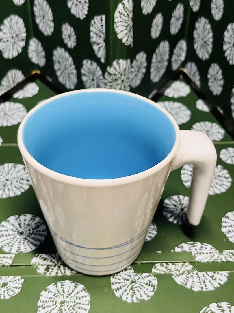 IKEA Ceramic Coffee Mug Blue Interior Striped Exterior (Category: Coffee & Tea Tableware) located in Malabon City. Submitted by mgsurplus (Listing ID 1466565003, Image 2). Description: - Genuine IKEA ceramic mug (Model 15199, made in Thailand) - Clean white exterior with stylish blue stripe details - Vibrant bright blue interior - Unique, easy-grip angular handle design - Standard everyday size, perfect for coffee, tea, or hot chocolate - Excelle