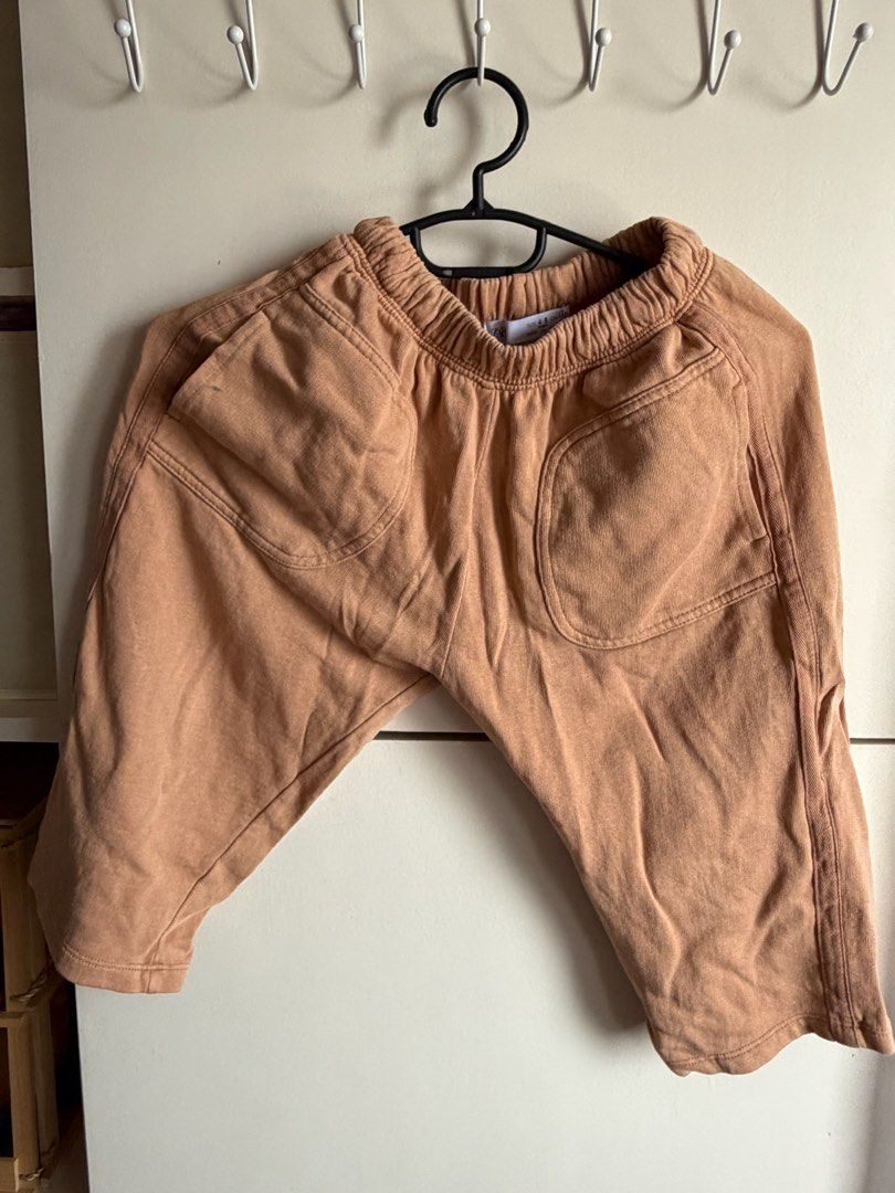 I’m (Category: Babies & Kids Fashion) located in Quezon City. Submitted by bubspreloved (Listing ID 1466724513, Image 3). Description: - Brand: Zara - Size: 4-5 years (110 cm) - Color: Brown - Material/Origin: Made in Morocco - Features: Elastic waistband, two front pockets, cute interior quote tag - Flaw: Small ink or paint stain on the right pocket (kindly check close-up photo).
