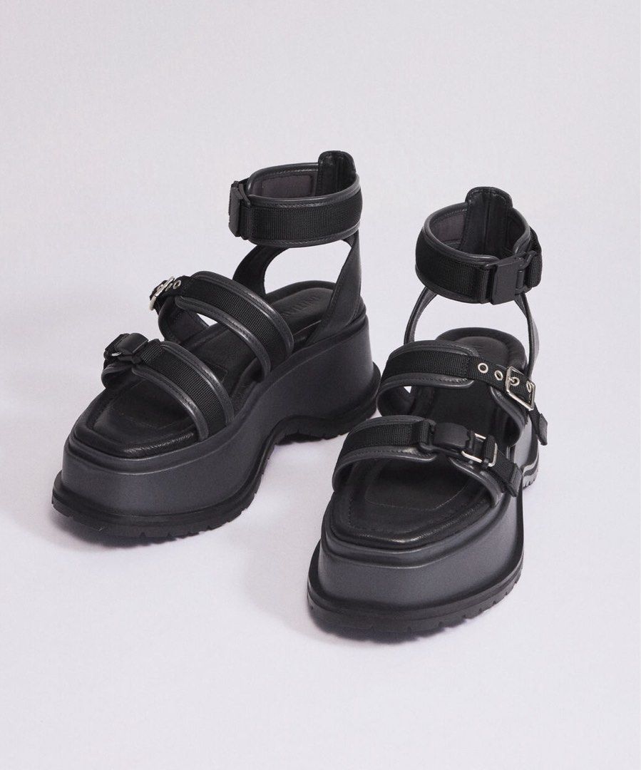 INITIAL Japan Black Platform Sandals Chunky Buckled Straps (Category: Flats & Sandals) located in Manila. Submitted by serendipitymanila (Listing ID 1466768397, Image 1). Description: - Color: Solid black - Design: Multiple adjustable straps with metal buckles - Sole: Heavy lug sole for extra height and grip - Styling: Wear bare or with socks - Versatility: Pairs great with skirts and jeans for a bold look.