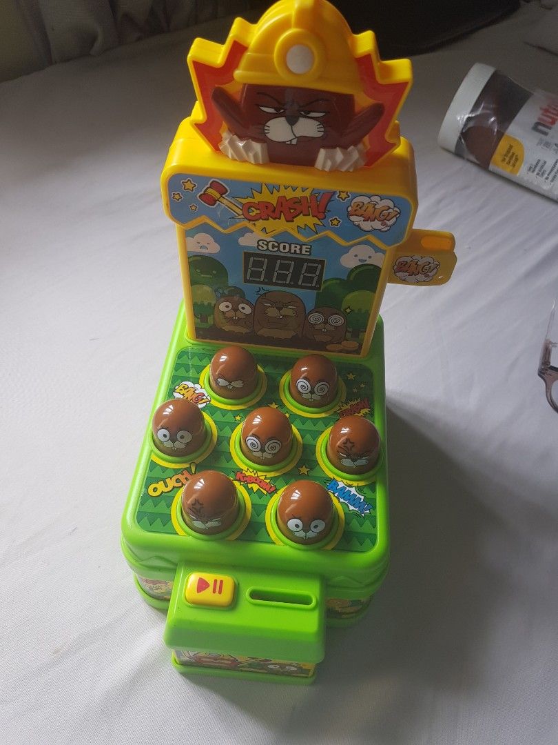 Interactive Whack-A-Mole Arcade Toy with Score Display (Category: Interactive Toys) located in Manila. Submitted by pepitapapaya (Listing ID 1466770283, Image 1). Description: Interactive electronic whack-a-mole game for kids. Features a digital score counter, fun sounds, and cute cartoon moles to help improve reflexes. Battery-operated..
