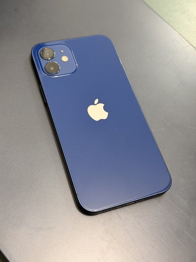 iPhone 12 (Category: iPhone 12 Series) located in Quezon City. Submitted by saveandrave01 (Listing ID 1466729420, Image 1). Description: - Model: Apple iPhone 12 - Color: Blue - Battery Health: 100% - Open line to any sim/e-sim - Condition: Good working condition with minor paint chipping around the camera module (as shown in photos) - Display & Body: Clean screen and sleek blue finish - Meetup Location: SM City North EDSA, Quezon City or Grab/La
