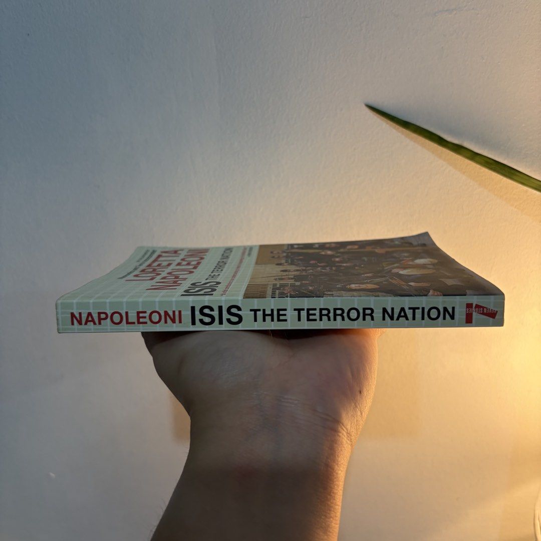 ISIS: The Terror Nation by Loretta Napoleoni (Category: Storybooks) located in Manila. Submitted by ajdeclutter (Listing ID 1466675350, Image 2). Description: - Title: Paperback on the rise of ISIS and Middle Eastern politics - Author: Renowned terrorism expert Loretta Napoleoni - Publisher: Seven Stories Press - Condition: Clean interior pages, with minor shelf wear on the cover .