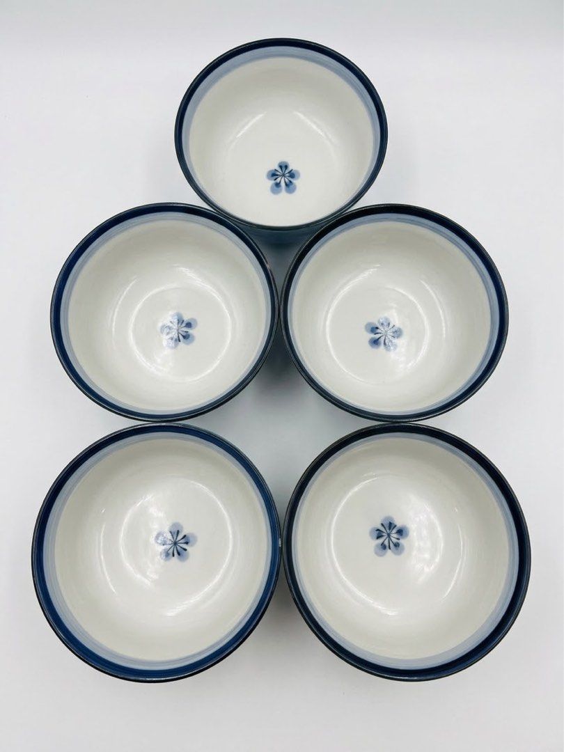 Japan blue glaze bowls (Category: Dinnerware & Cutlery) located in Manila. Submitted by rlab_japan_thrift (Listing ID 1466686390, Image 1). Description: Japanese Vintage Blue Glaze Ceramic Tea / Rice Bowls 2 sets💙🌸 ₱500 2 sets Beautiful set of authentic Japanese ceramic bowls featuring a vibrant medium-blue textured outer body, a hand-painted blue floral motif (plum blossom / sakura) inside the center, and a smooth gradient rim. Perfect size fo