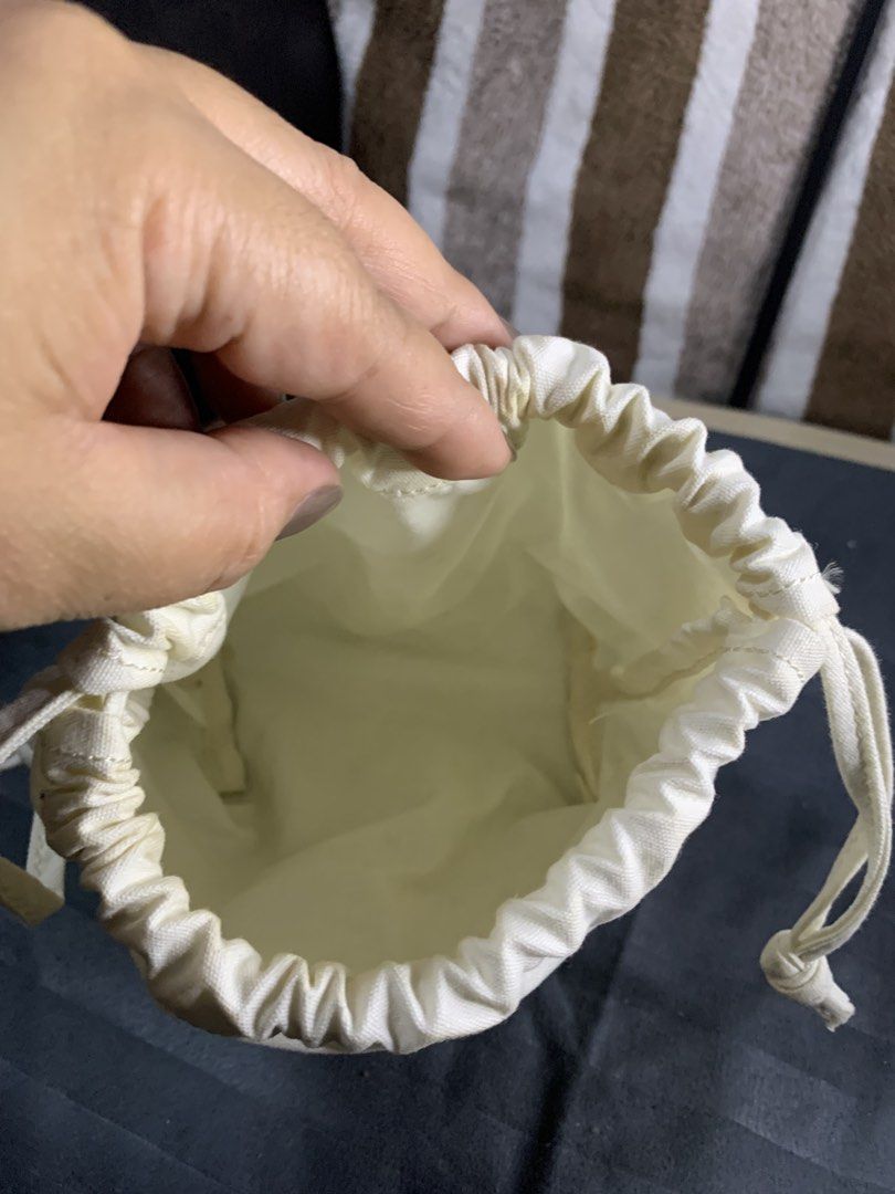 Japan canvas string pouch (Category: Purses & Pouches) located in Cabanatuan. Submitted by mjluxxejapan (Listing ID 1466576082, Image 3). Description: Fixed price approx 7”x7” meas makapal matibay tela need was medyo may dirt lang milky white color .