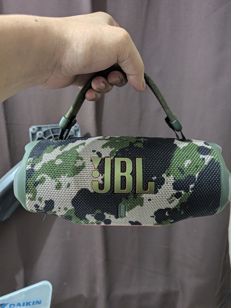JBL Charge 6 Squad (Category: Soundbars, Speakers & Amplifiers) located in Makati City. Submitted by jb14corpuz (Listing ID 1466721491, Image 3). Description: - Model: JBL Charge 6 Wireless Speaker - Color: Stylish Camo Green pattern - Connectivity: Latest Bluetooth V5.4 support - Battery Life: Up to 28 hours of continuous playtime - Portability: Includes a handy carrying strap attached to the top - Packaging: Original box included with inside pa