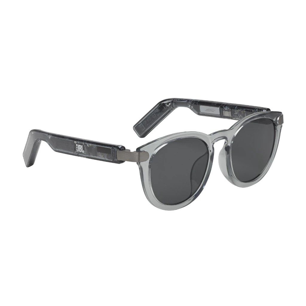 RUSH SALE TODAY ONLY! JBL Soundgear Frames Audio Sunglasses Translucent Grey (Category: Sunglasses & Eyewear) located in Manila. Submitted by stashyyfinds (Listing ID 1466578548, Image 3). Description: - Model: JBL Soundgear Frames - Color: Translucent grey with dark grey tinted lenses - Audio: Built-in open-ear speakers in temples for music and calls - Design: Lightweight, futuristic everyday eyewear - Inclusions: Matching grey leatherette hard 