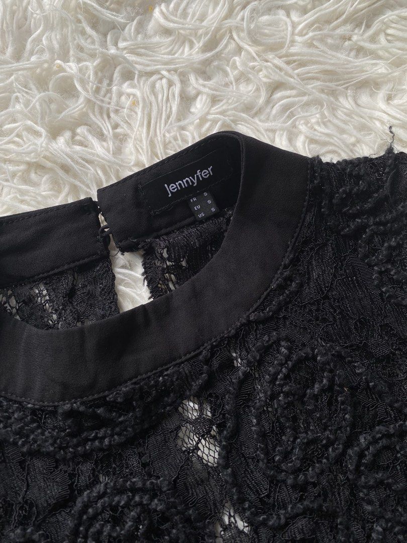 Jennyfer Black Lace High Neck Top (Category: Sleeveless) located in Tabaco. Submitted by camila_p (Listing ID 1466772264, Image 3). Description: - Brand/Item: Jennyfer Black Lace Top - Size: Small - Design: Textured floral lace with sheer mesh panels and a scalloped hem - Details: High mock collar with back neck button closure - Material: Lightweight fabric - Versatility: Great for layering or a stylish night out - Condition: Brand New, Never use