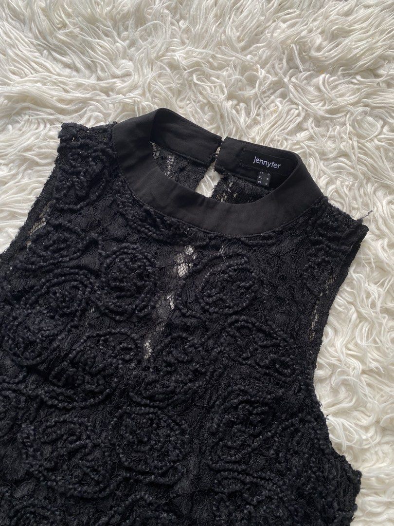 Jennyfer Black Lace High Neck Top (Category: Sleeveless) located in Tabaco. Submitted by camila_p (Listing ID 1466772264, Image 2). Description: - Brand/Item: Jennyfer Black Lace Top - Size: Small - Design: Textured floral lace with sheer mesh panels and a scalloped hem - Details: High mock collar with back neck button closure - Material: Lightweight fabric - Versatility: Great for layering or a stylish night out - Condition: Brand New, Never use