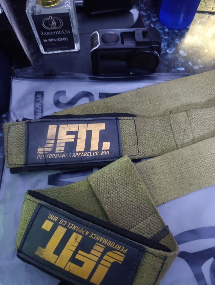 JFIT Performance Apparel Co. MNL Wrist Wraps (Category: Weights & Dumbbells) located in Manila. Submitted by mrjmodina87184 (Listing ID 1466654109, Image 2). Description: - Brand: JFIT - Color: Army green with yellow branding - Material: Heavy-duty cotton with durable edge stitching - Support: Solid wrist support for heavy lifts, powerlifting, and CrossFit - Closure: Secure Velcro closure - Care: Hand-washable.