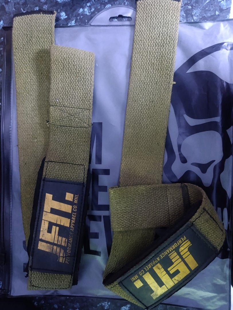 JFIT Performance Apparel Co. MNL Wrist Wraps (Category: Weights & Dumbbells) located in Manila. Submitted by mrjmodina87184 (Listing ID 1466654109, Image 3). Description: - Brand: JFIT - Color: Army green with yellow branding - Material: Heavy-duty cotton with durable edge stitching - Support: Solid wrist support for heavy lifts, powerlifting, and CrossFit - Closure: Secure Velcro closure - Care: Hand-washable.