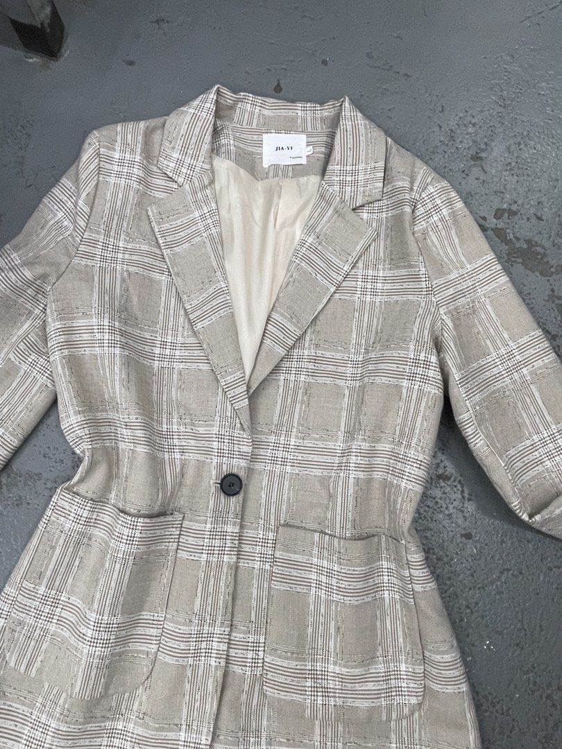 JIA-YI Beige Plaid Blazer Jacket Size L (Category: Coats, Jackets and Outerwear) located in Bulacan. Submitted by grazcloset (Listing ID 1466589814, Image 2). Description: NOTE : NO WHEN WORN - Brand/Model: JIA-YI beige plaid blazer - Size: L - Design: Lapel collar, single button front closure, structured waist, and two large patch pockets - Lining: Fully lined with cream fabric - Style: Versatile neutral piece, ideal for work outfits or casual l
