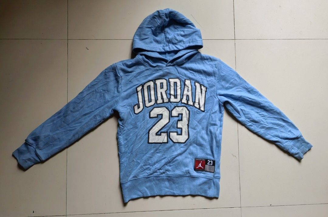 Jordan 23 Light Blue Hoodie (Category: Coats, Jackets and Outerwear) located in Quezon. Submitted by miksxthrift (Listing ID 1466672304, Image 1). Description: - Authentic light blue Jordan hoodie - Features bold Jordan lettering and number 23 on the chest - Classic pullover style with an adjustable hood and ribbed cuffs - Includes a woven jock tag near the hem - Shows minor wear and fading from previous use - Great, comfortable piece for casual 