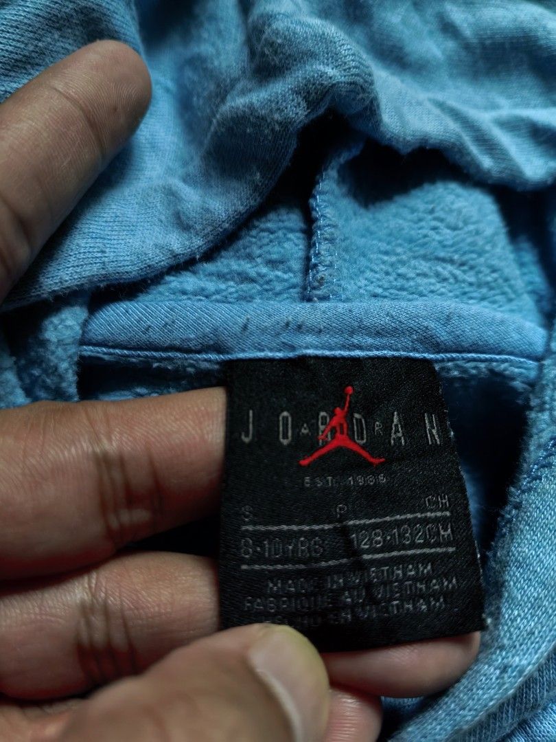 Jordan 23 Light Blue Hoodie (Category: Coats, Jackets and Outerwear) located in Quezon. Submitted by miksxthrift (Listing ID 1466672304, Image 2). Description: - Authentic light blue Jordan hoodie - Features bold Jordan lettering and number 23 on the chest - Classic pullover style with an adjustable hood and ribbed cuffs - Includes a woven jock tag near the hem - Shows minor wear and fading from previous use - Great, comfortable piece for casual 