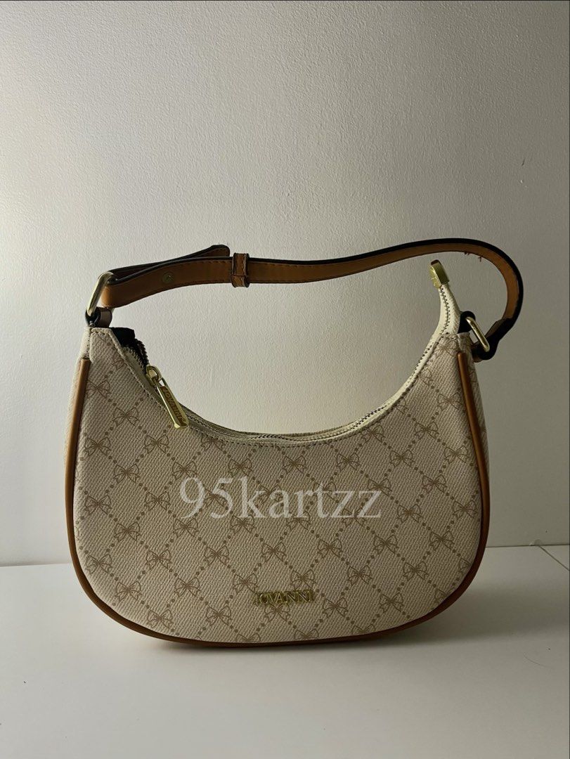 Jovanni cream and brown patterned crescent shoulder bag (Category: Shoulder Bags) located in Cabanatuan. Submitted by 95kart (Listing ID 1466576322, Image 1). Description: MOP: Go tyme or Maribank MOD: Lalamove LOCATION: Cabanatuan City, N.E.