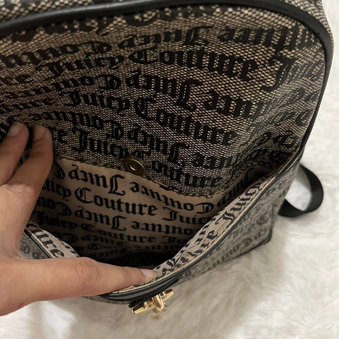 Juicy Couture Monogram Black & White Backpack (Category: Backpacks) located in Consolacion. Submitted by everythingispreloved_ (Listing ID 1466655244, Image 3). Description: - Authentic Juicy Couture black & white monogram backpack - Structured top handle and comfortable adjustable shoulder straps - Front flap pocket with secure padlock and key charm hardware - Smooth gold-tone zip closure for the main compartment - Convenient side slip pockets f