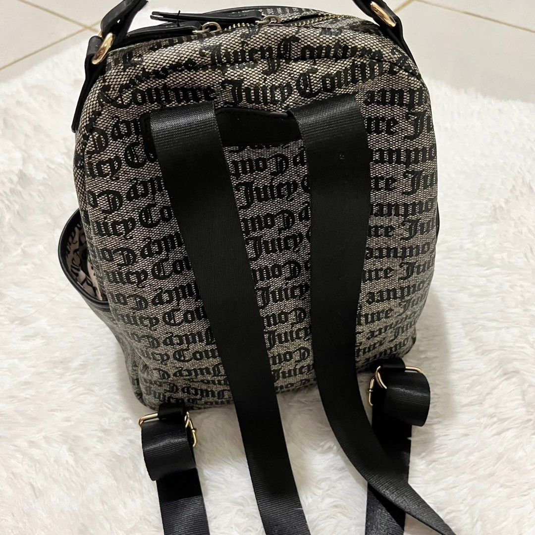 Juicy Couture Monogram Black & White Backpack (Category: Backpacks) located in Consolacion. Submitted by everythingispreloved_ (Listing ID 1466655244, Image 2). Description: - Authentic Juicy Couture black & white monogram backpack - Structured top handle and comfortable adjustable shoulder straps - Front flap pocket with secure padlock and key charm hardware - Smooth gold-tone zip closure for the main compartment - Convenient side slip pockets f