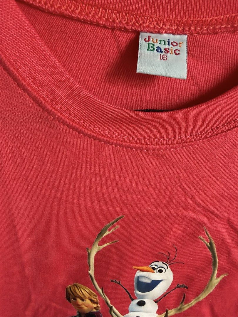 Junior Basic Frozen Graphic T-Shirt Red Size 16 (Category: Babies & Kids Fashion) located in Quezon City. Submitted by bubspreloved (Listing ID 1466725867, Image 3). Description: - Design: Features Frozen characters Olaf, Sven, Anna, and Kristoff on the front - Color: Bright red with a solid plain back - Material: Soft and comfortable cotton - Style: Short sleeves with classic crew neck - Size: Size 16 (Junior Basic brand label) - Condition: Grea