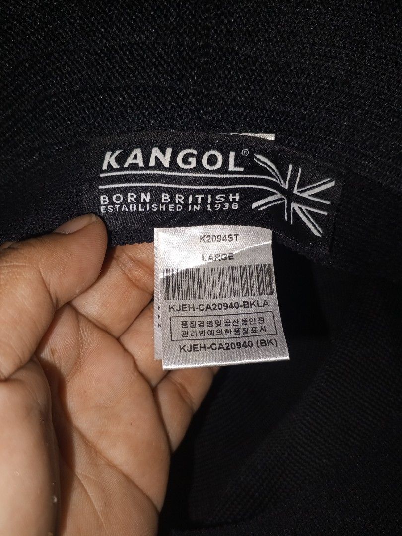 Kangol black bucket hat size Large (Category: Caps & Hats) located in Magalang. Submitted by zeiansoria64090 (Listing ID 1466594549, Image 2). Description: - Authentic black Kangol bucket hat - Size: Large (Model: K2094ST) - Classic embroidered kangaroo logo on the front - Premium textured knit fabric material - Clean interior branding with UK flag graphic - Brand new with original barcode tag attached - Ready to wear.
