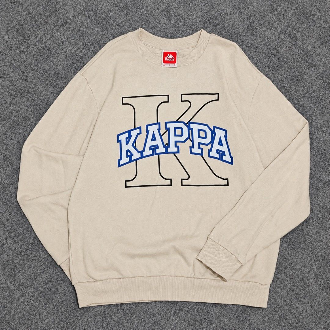 Kappa Collegiate Graphic Logo Sweatshirt (Category: Coats, Jackets and Outerwear) located in Bay. Submitted by ndrwthrift (Listing ID 1466764555, Image 1). Description: Kappa Collegiate Graphic Logo Sweatshirt Condition - 9/10 Size - Medium on tag Dimes - L 27" W 21" Color Rate - 9/10 Issue - Slight logo print cracks, washable stains *meet up or shipping via lalamove (buyer's expense) *can ship nationwide via j&t.