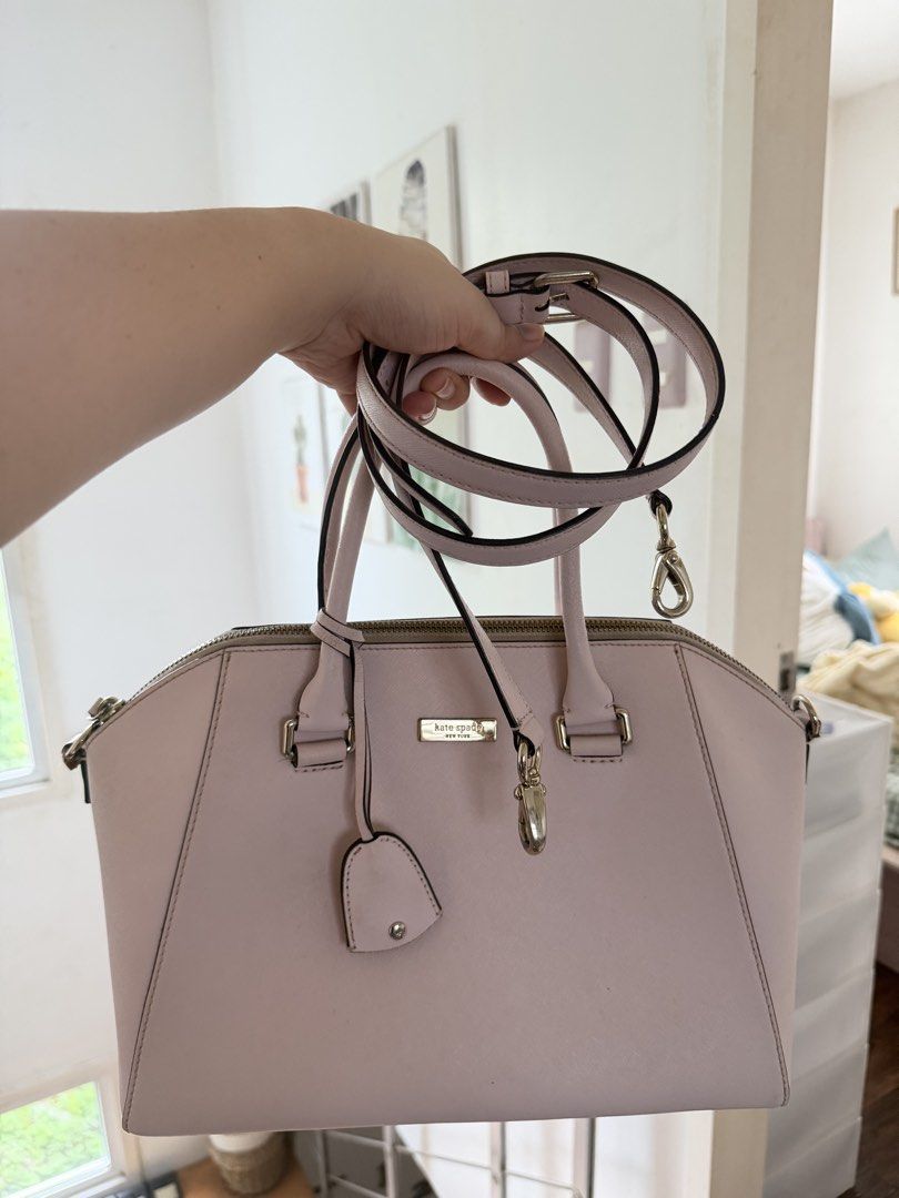 Kate Spade bag - light pink (Category: Cross-body Bags) located in Manila. Submitted by cinnmoroll (Listing ID 1466650387, Image 2). Description: Flaws: chipping, scratches, need stitch sa strap holder if will use the long strap, need proper cleaning.