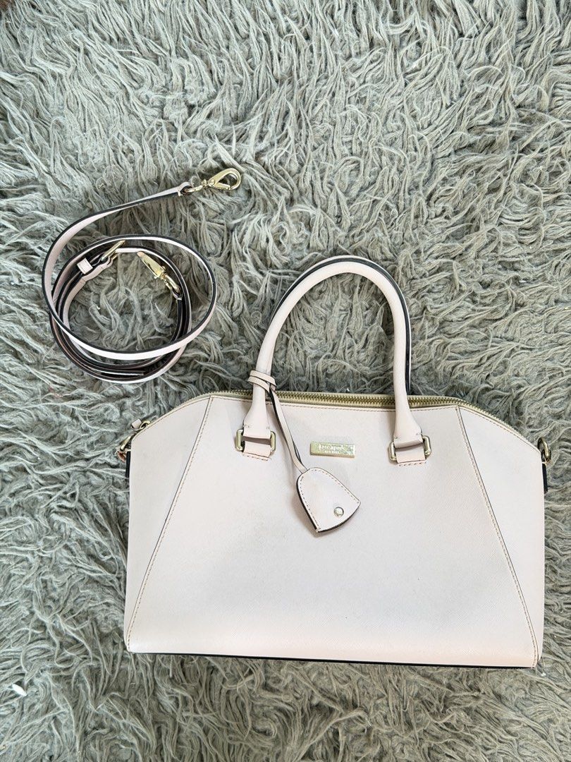 Kate Spade bag - light pink (Category: Cross-body Bags) located in Manila. Submitted by cinnmoroll (Listing ID 1466650387, Image 1). Description: Flaws: chipping, scratches, need stitch sa strap holder if will use the long strap, need proper cleaning.