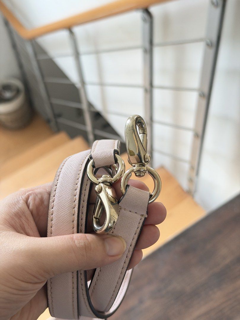 Kate Spade bag - light pink (Category: Cross-body Bags) located in Manila. Submitted by cinnmoroll (Listing ID 1466650387, Image 3). Description: Flaws: chipping, scratches, need stitch sa strap holder if will use the long strap, need proper cleaning.