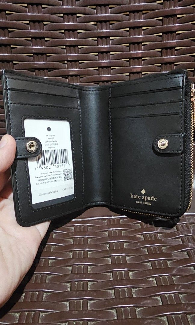 KATE SPADE SMALL L-ZIP WALLET (Category: Wallets & Card Holders) located in Taytay. Submitted by smallgoodiesph (Listing ID 1466638153, Image 2). Description: Measurements: Length: 4.8" Height: 3.7" Material: Saffiano Leather Features: Exterior slip pocket Interior ID window, 2 slip pockets, bill slot 5 interior credit card slots Snap closure L-Zip Coin Compartment Metal logo Dust Bag Included: No Deacription: Polished and compact, Kate Spade Sma