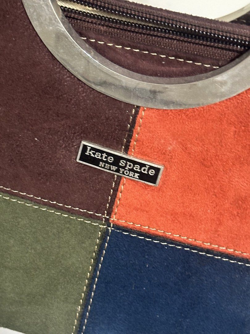 Kate Spade Vintage Multicolor Suede Handbag (Category: Luxury Bags & Wallets) located in Bacoor. Submitted by krsha_al (Listing ID 1466768074, Image 2). Description: Hardware: Distinctive silver-tone metal ring handles (minor surface wear on metal) Closure: Secure top zip closure Interior: Beige fabric lining with 1 zippered pocket and slip pockets Good pre-loved condition No sling.