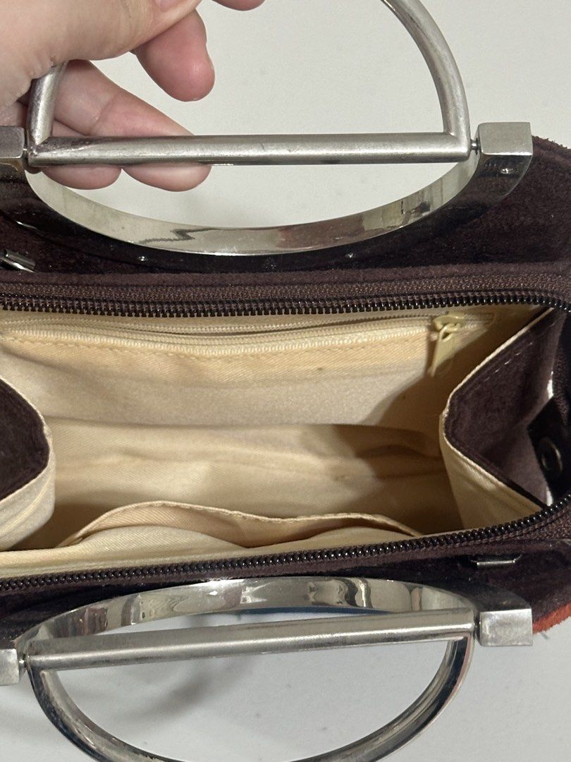 Kate Spade Vintage Multicolor Suede Handbag (Category: Luxury Bags & Wallets) located in Bacoor. Submitted by krsha_al (Listing ID 1466768074, Image 3). Description: Hardware: Distinctive silver-tone metal ring handles (minor surface wear on metal) Closure: Secure top zip closure Interior: Beige fabric lining with 1 zippered pocket and slip pockets Good pre-loved condition No sling.