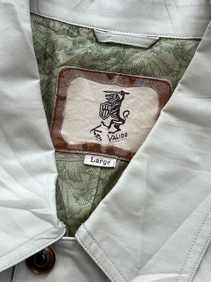 Ken Valido Vintage Cream Casual Jacket Size Large (Category: Coats, Jackets and Outerwear) located in Caloocan City. Submitted by sillapwet0606 (Listing ID 1466571824, Image 3). Description: - Brand: Ken Valido - Size: Large - Color: Cream with green patterned inner lining - Design: Detailed front panels with textured vertical stripes and shoulder trim - Closure & Cuffs: Branded horn-style buttons - Hem: Elastic ribbed waistband - Origin: Made in
