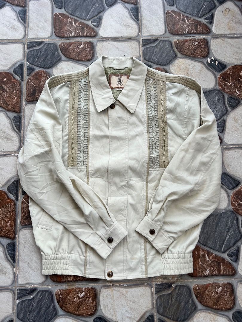Ken Valido Vintage Cream Casual Jacket Size Large (Category: Coats, Jackets and Outerwear) located in Caloocan City. Submitted by sillapwet0606 (Listing ID 1466571824, Image 1). Description: - Brand: Ken Valido - Size: Large - Color: Cream with green patterned inner lining - Design: Detailed front panels with textured vertical stripes and shoulder trim - Closure & Cuffs: Branded horn-style buttons - Hem: Elastic ribbed waistband - Origin: Made in