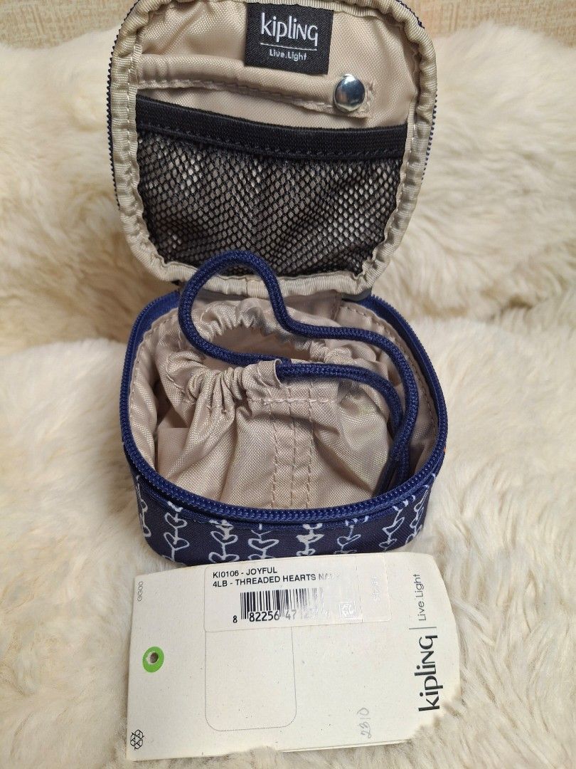 Kipling Joyful jewelry travel case (Category: Purses & Pouches) located in Rizal. Submitted by emskititay (Listing ID 1466679449, Image 1). Description: ●Jewelry travel case ●Used only once ●10/10 color condition ●navy blue with heart prints ●L9.3 cm x W9 cm xH 5.1 cm ●Excellent condition Location: Taytay Rizal 💼Rfs Decluttering my Kipling collections.