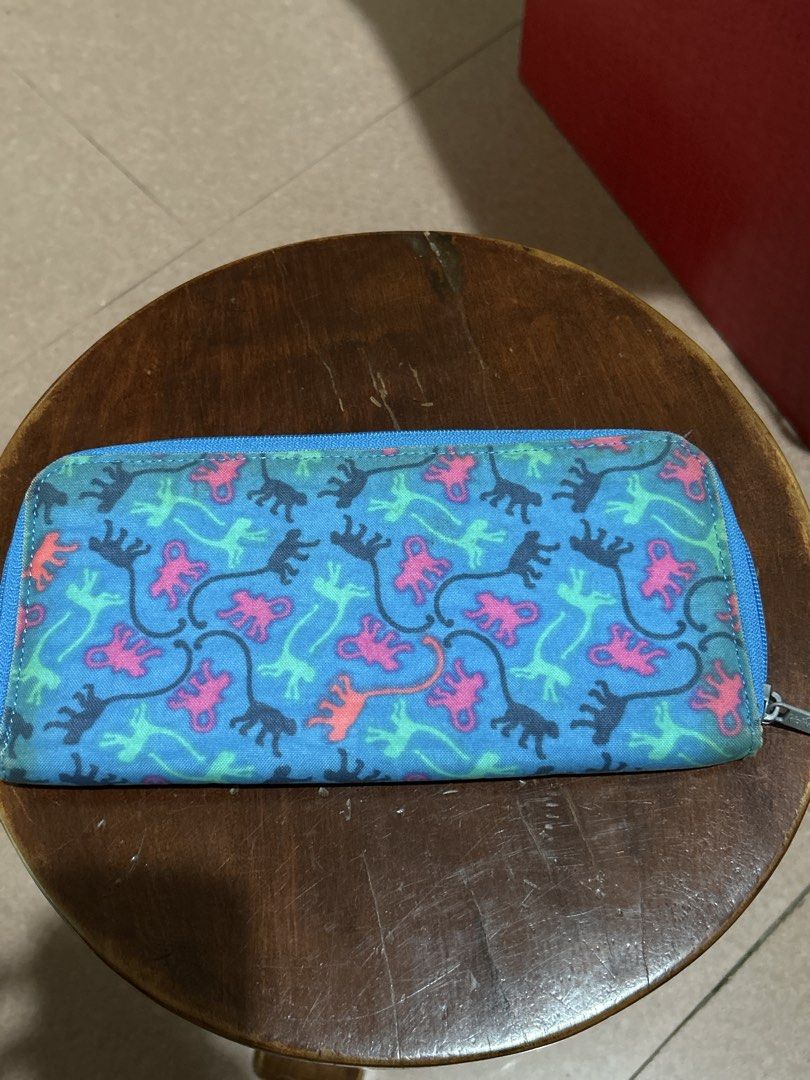 Kipling Long Zip Around Wallet Blue Monkey Print (Category: Wallets & Card holders) located in Alitagtag. Submitted by patrickvillanueva (Listing ID 1466629039, Image 2). Description: - Authentic Kipling long wallet in blue with a playful colorful monkey pattern - Secure round zip closure and convenient exterior front zipper pocket - Organized interior with multiple card slots, compartments, ID window, and a small pen loop - Features the classic 