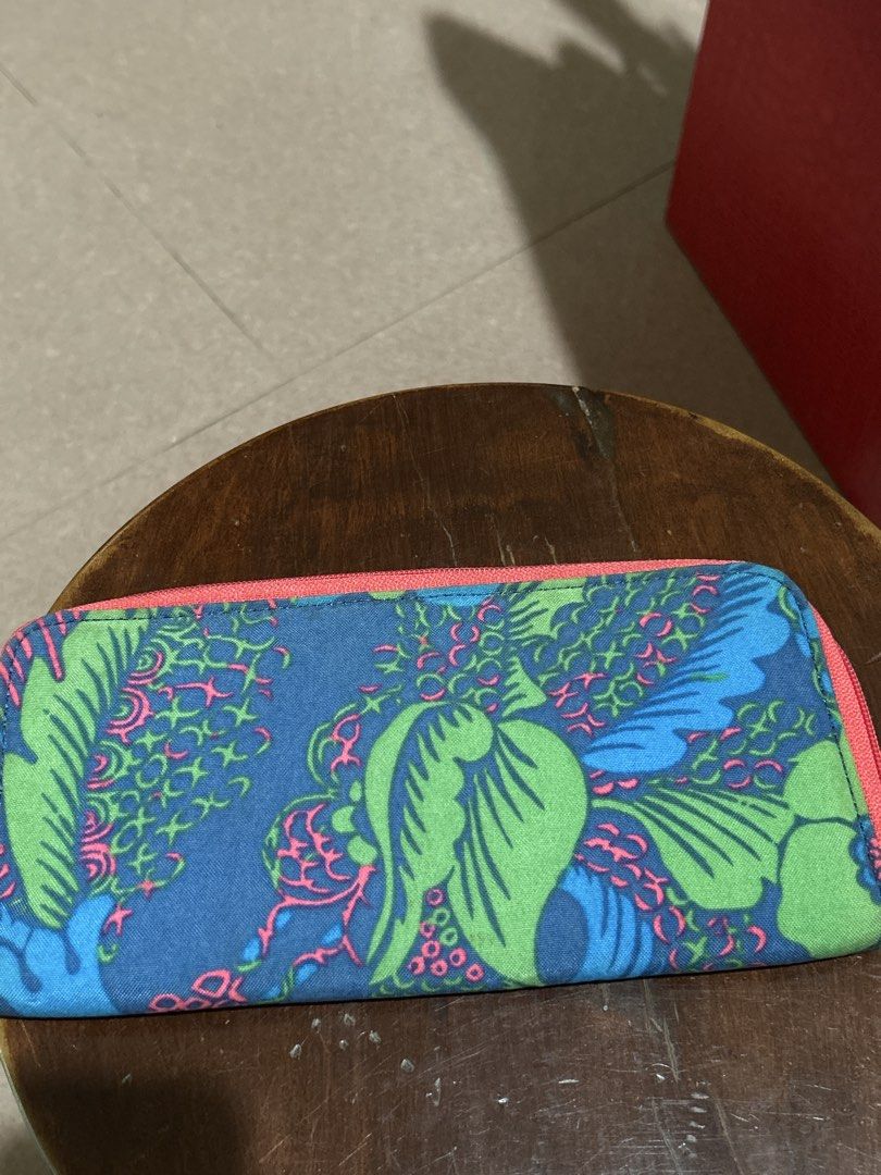 Kipling Long Zip Around Wallet Blue Floral (Category: Wallets & Card holders) located in Alitagtag. Submitted by patrickvillanueva (Listing ID 1466630273, Image 2). Description: - Brand: Kipling - Design: Blue with a colourful floral pattern and bright pink zip trim - Features: Multiple card slots, cash compartments, and a clear ID window - Condition: Interior fabric has some staining and marks from use; zip closure works smoothly - Perfect size 