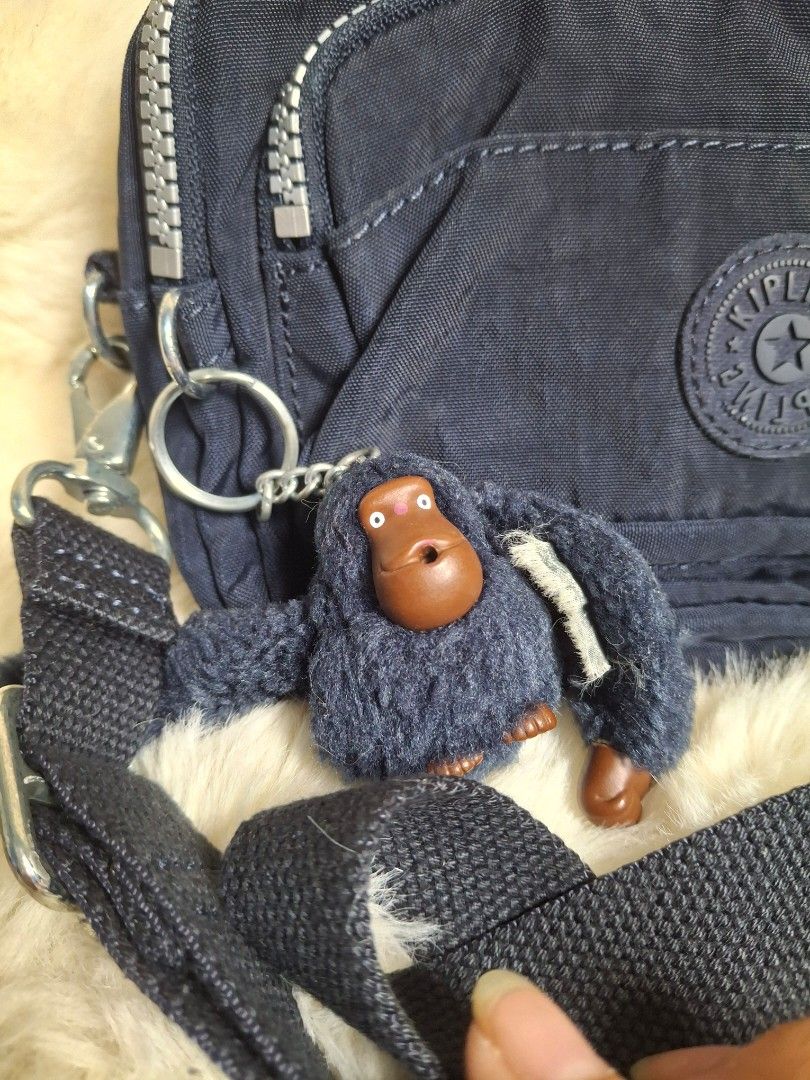 Kipling Merryl sling/belt bag (Category: Cross-body Bags) located in Rizal. Submitted by emskititay (Listing ID 1466692257, Image 3). Description: Kipling Merryl Sling/Belt bag ₱1200 ●2 in 1 sling or belt bag ●with monkey ●10/10 color condition ●Blue tonal ●H 13 cm x L 19 cm x W 8 cm ●Replaced side hook hardware and cracking on belt bag strap leather part only Location: Taytay Rizal 💼Rfs Decluttering my kipling collections.